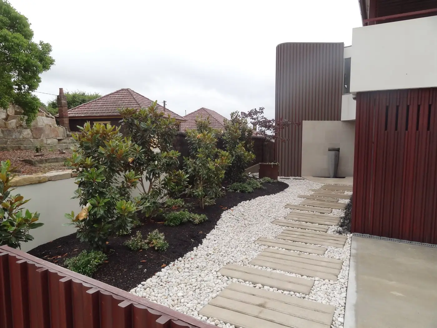 Decorative pebble surrounding concrete steppers